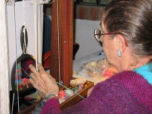 Olga Neuts working on her tapestry