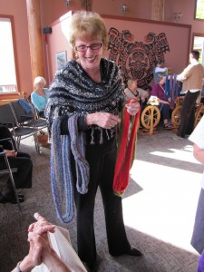 One of the organizers, Lynn Hilton, modelling a selection of mobius scarves